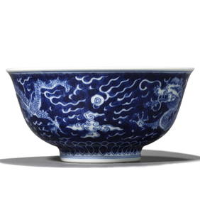 A CHINESE BLUE AND WHITE BOWL WITH CLOUD AND DRAGON DESIGN, MARKED 'DA QING DAO GUANG NIAN ZHI,' (1 of 3)