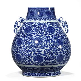 A CHINESE BLUE AND WHITE LOTUS DESIGN DOUBLE-EARED VASE, MARKED "DA QING QIANLONG NIAN ZHI," (1 of 3)