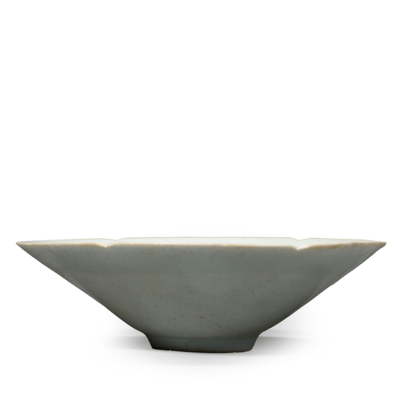 A CHINESE DING YAO FLOWER-RIMMED DOULI TEA CUP.: A CHINESE DING YAO FLOWER-RIMMED DOULI TEA CUP. Dimensions:Height: 1 9/16 in. (4 cm), Diameter: 5 1/4 in. (13.3 cm) ALL ITEMS SOLD AS IS, NO RETURNS Condition: Any statement made in any catalogue