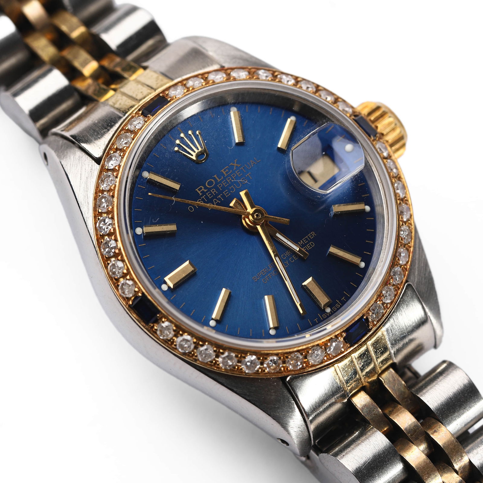 ROLEX OYSTER PERPETUAL DATEJUST STAINLESS STEEL AND GOLD WRISTWATCH WITH DIAMOND BEZEL: Dimensions: Dial diameter approx. 1 1/16 in. (27.5 mm)A Rolex Oyster Perpetual Datejust wristwatch featuring a vibrant sunray blue dial with applied gold baton hour markers, sweep center seconds, and