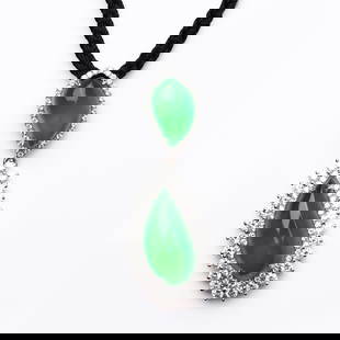 JADEITE AND DIAMOND PENDANT: Dimensions Length approx. 1 9/16 in. (4 cm); small jadeite approx. 17/32 × 21/64 × 5/16 in. (13.3 × 8.4 × 7.8 mm); large jadeite approx. 23/32 × 3/8 × 23/64 in. (18.4 × 9.4 × 9.2 mm) Descripti