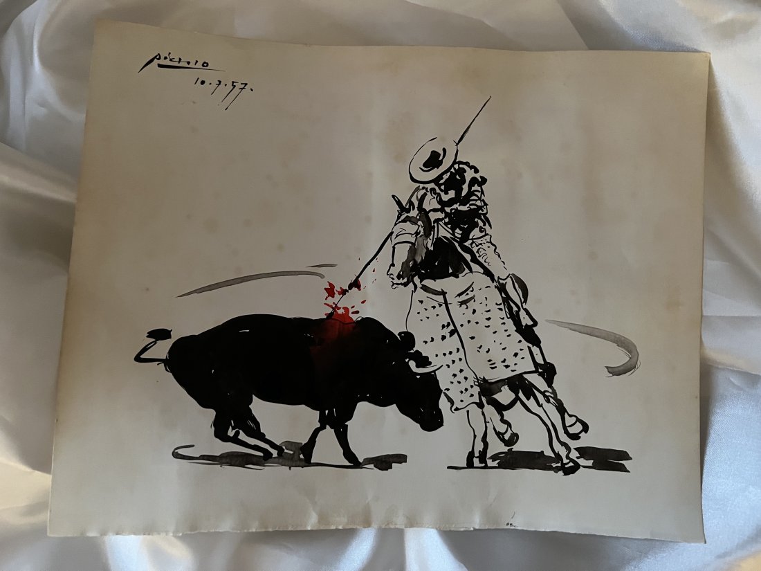 Picasso original painting of a Bull fight 1957: Lot number 84 is an original painting by Pablo Picasso of a Bull fighting Red and Black paint and signed to the upper left hand corner and dated10.7.57. It is 27cm by 21.4cm in size and holds the muse