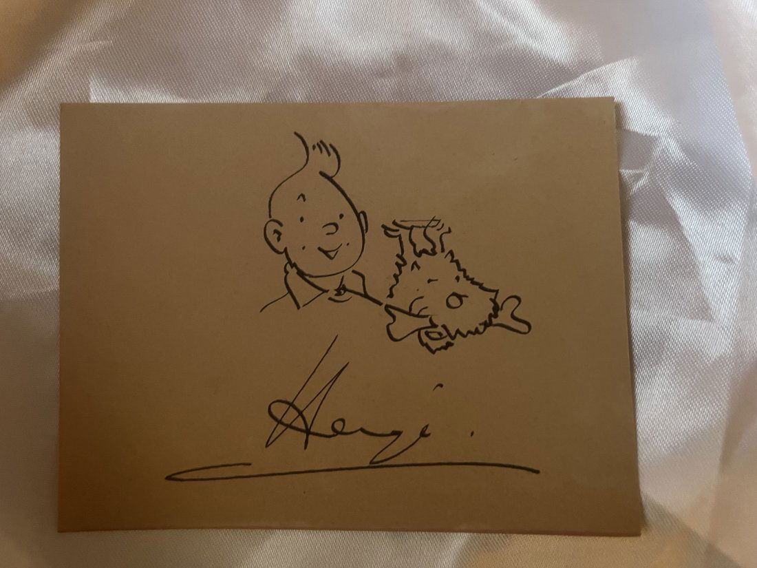 TinTin & Snowy Herge drawing: Lot number 49 is an original Herge drawing in black ink to dark cream thin card of TinTin and Snowy by Herge. This is a smaller original at 4 3/4 inches by 3 3/4 inches in size.