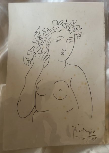 Pablo Picasso (Spanish, 1881-1973) -- Hand Signed Nude Lady: Lot number 51 is an original pen and ink drawing by Pablo Picasso. It is black ink to cream paper. it is drawn, signed and dated 11.7.69 and depicts a nude lady. On the rear is his own printing stamp 