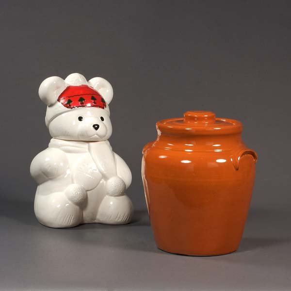 Two vintage ceramic cookie jars; one is shaped lik: Two vintage ceramic cookie jars; one is shaped like a teddy bear, with the head of the teddy bear as the lid, the other is the classic cookie jar.