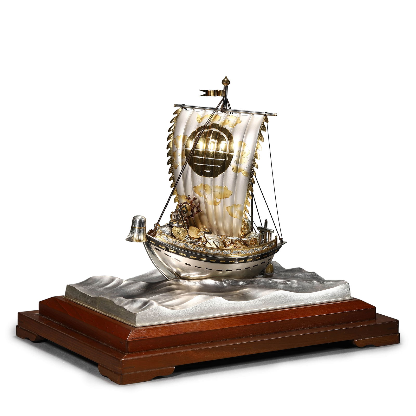 JAPANESE SILVER TREASURE SHIP SCULPTURE: DIMENSIONS:Overall: 8 1/2 × 5 1/8 × 7 1/16 in. (21.5 × 13 × 18 cm) DESCRIPTION: A meticulously crafted Japanese treasure ship sculpture composed of silver with applied gold and mixed metal details