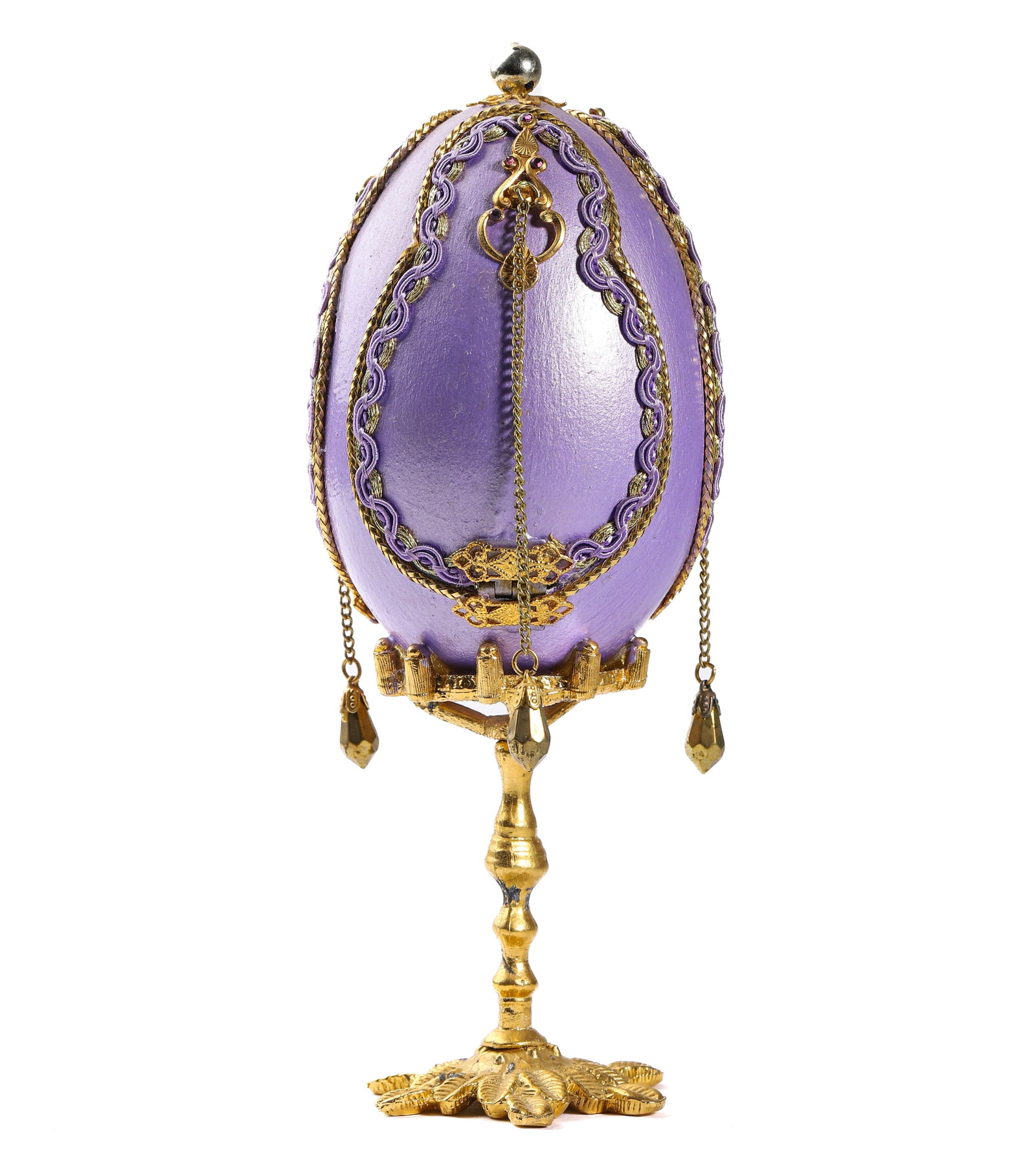 A GILDED AND PURPLE HINGED EGG ORNAMENT WITH CHERUB: Height: 6 1/4 in (16 cm).