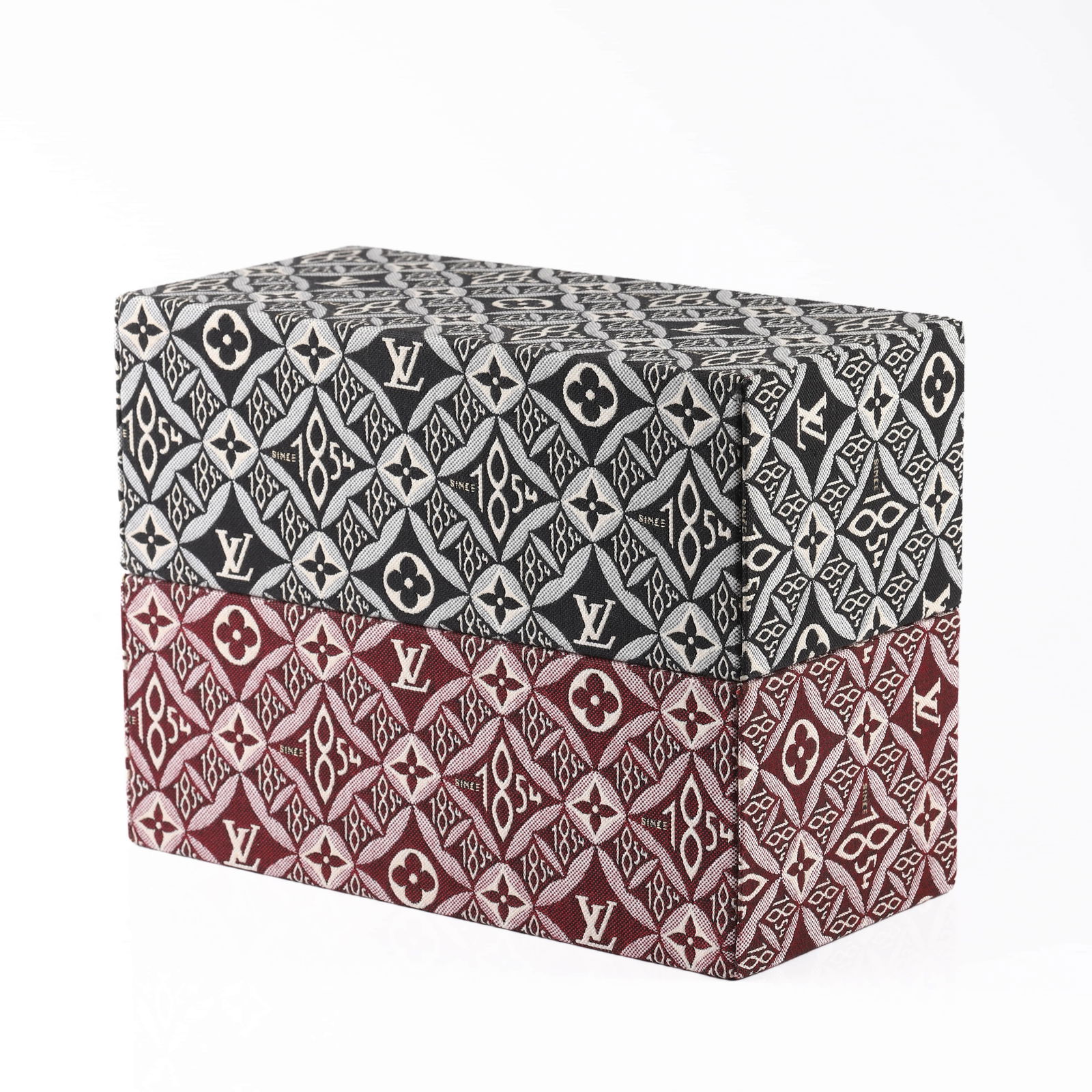 LOUIS VUITTON MONOGRAM JACQUARD FABRIC BOX: Dimensions 11 in (28 cm) × 5 5/16 in (13.5 cm) × 4 1/8 in (10.5 cm) Description A Louis Vuitton monogram jacquard fabric box featuring the iconic LV initials and fleur-de-lys motifs, interspersed wi