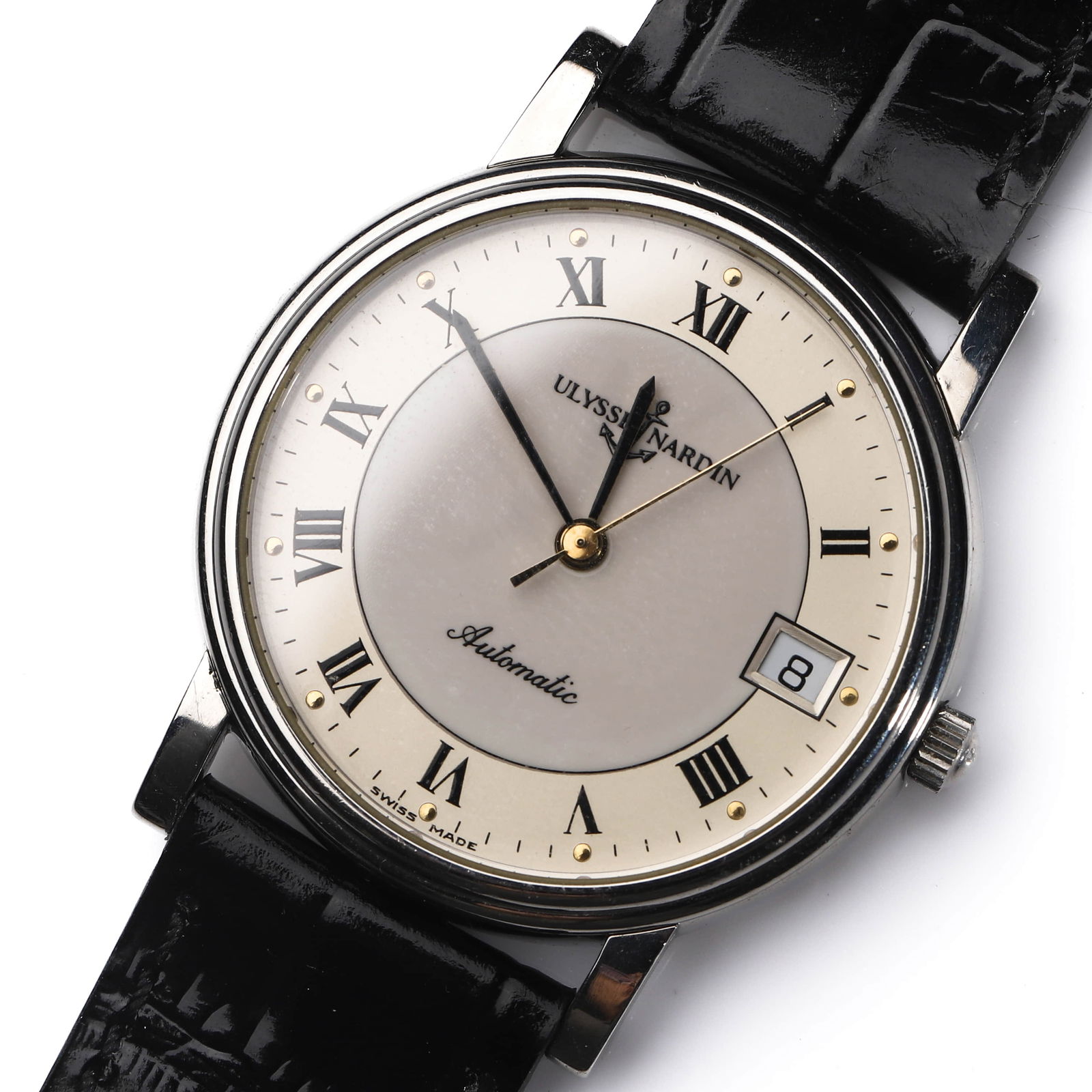 ULYSSE NARDIN. AN AUTOMATIC DATE WRISTWATCH: Dimensions Case diameter: approx. 1 3/8 in. (34.8 mm); overall length: approx. 8 7/8 in. (22.5 cm). Description An elegant Swiss wristwatch by Ulysse Nardin, featuring a classic silvered dial with app