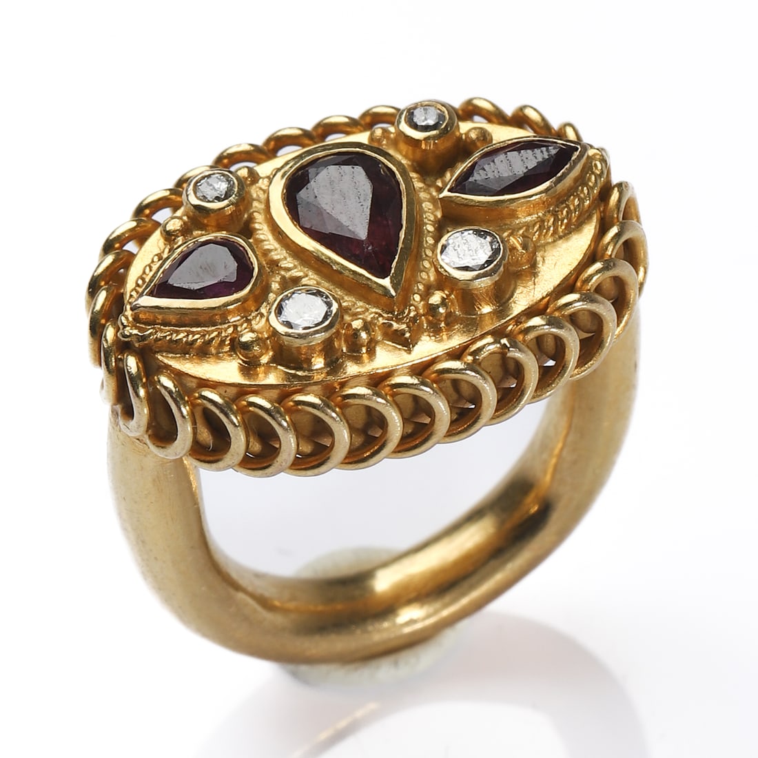 ITALIAN ARCHAEOLOGICAL REVIVAL RUBY AND DIAMOND GOLD RING: Dimensions Inner diameter: 17/32 in (13.6 mm); Ring size: Hong Kong size 5 (US size 2.75); Weight: 7.3 g Description An elegant Italian Archaeological Revival gold ring, handcrafted in 18K gold, as co