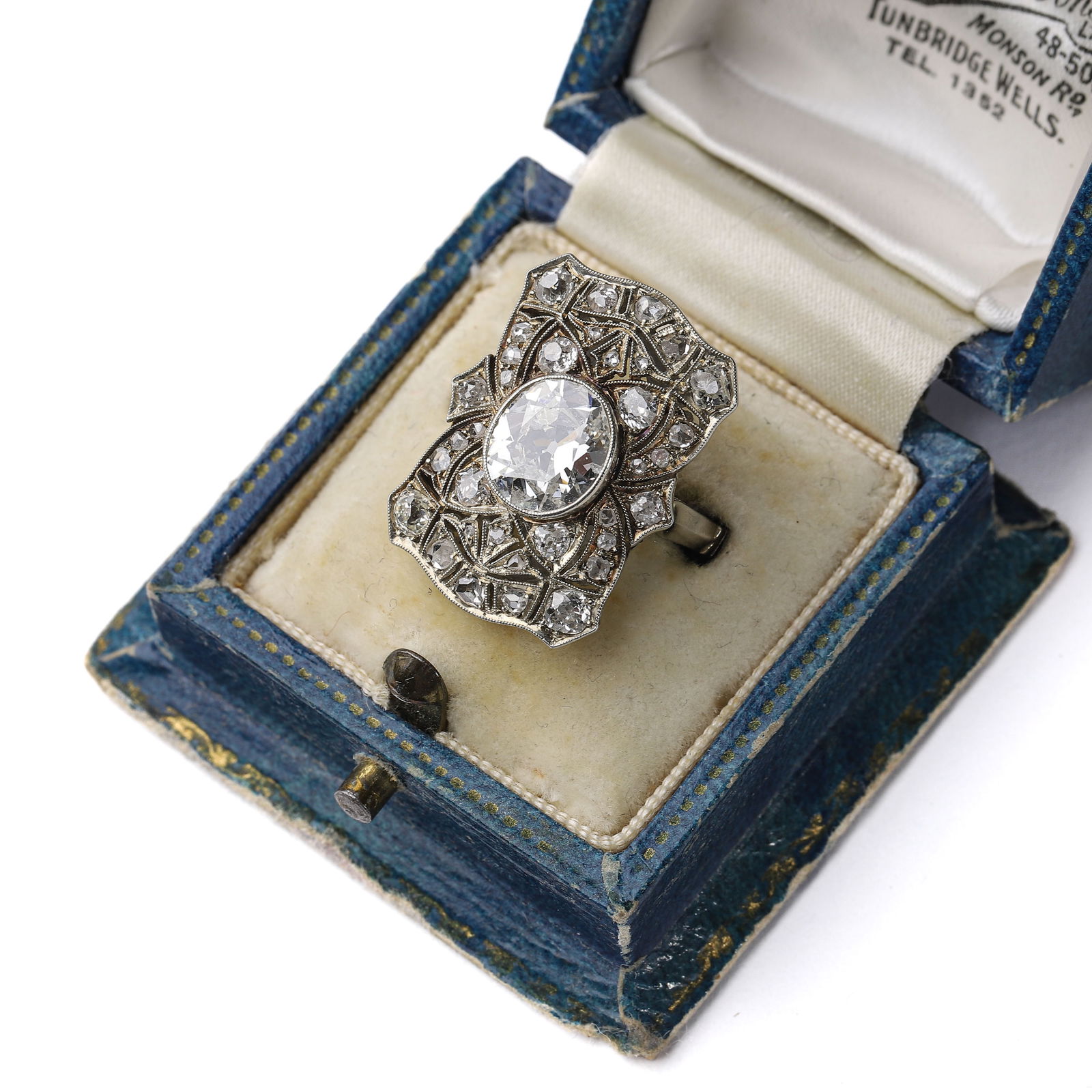 ART DECO ITALIAN NOBILITY CUSTOM 3-CARAT DIAMOND RING: This Art Deco (1925-1935) diamond ring was custom-made for Italian nobility, featuring an 18K gold handcrafted setting. The design showcases the intricate openwork carving style characteristic of the