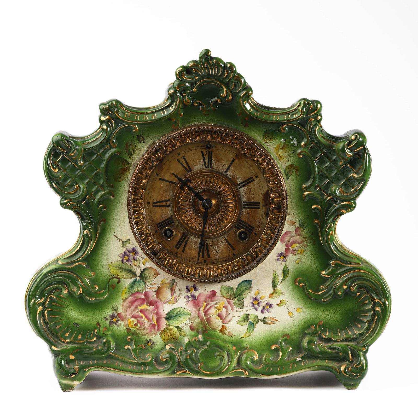 DRESDEN EXTRA PORCELAIN MANTEL CLOCK, NO. 1071: Dimensions: Height: 12 1/4 in. (31 cm), Length: 13 in. (33 cm) Description: A finely crafted porcelain mantel clock with rich green and ivory ground, adorned with hand-painted floral motifs and ornate