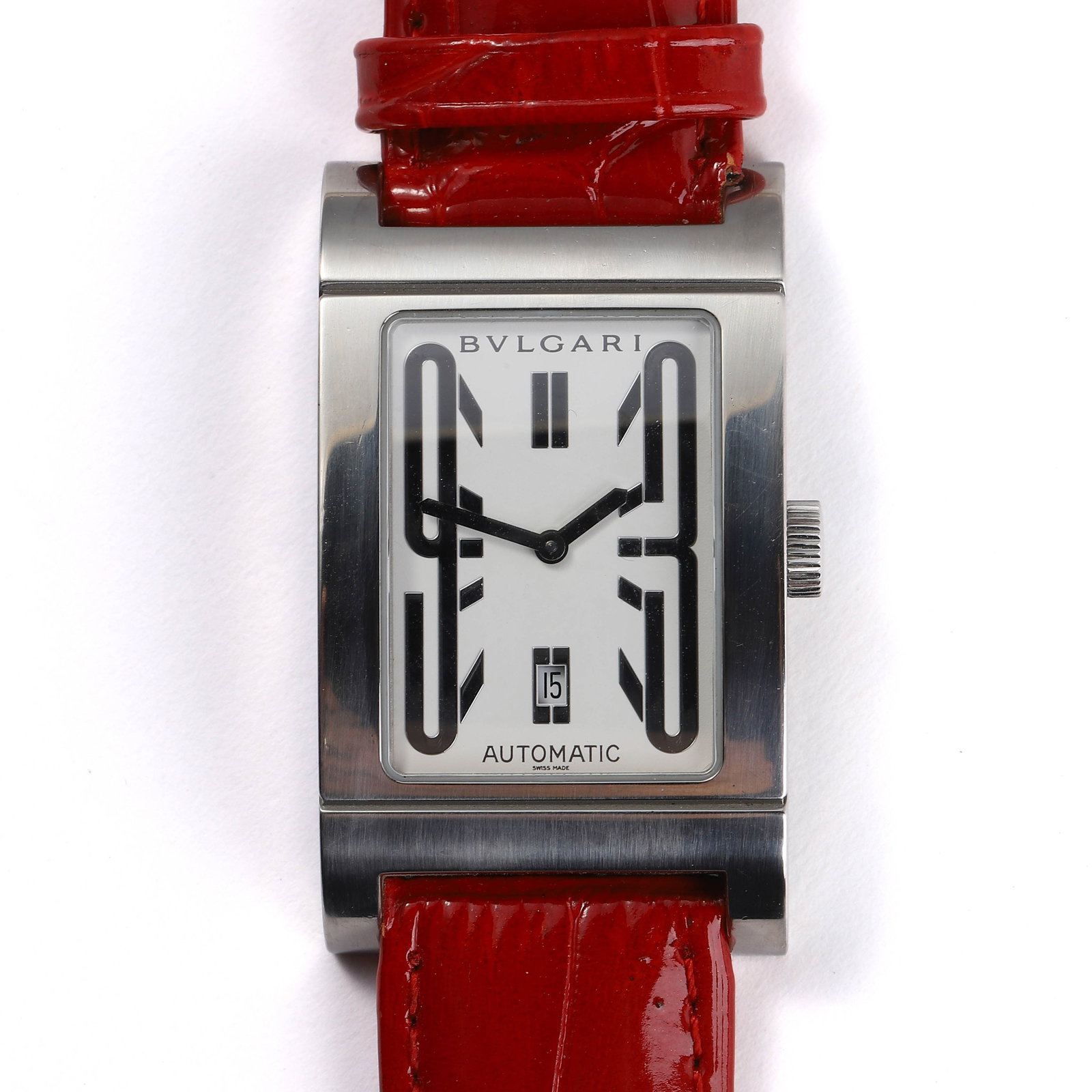 BVLGARI STAINLESS STEEL AUTOMATIC WRISTWATCH: dial length: 1 3/16 in (3 cm) A BVLGARI STAINLESS STEEL AUTOMATIC WRISTWATCH. THE RECTANGULAR CASE FEATURES A WHITE DIAL WITH BLACK HOUR MARKERS AND A DATE WINDOW AT 6 O’CLOCK. ENGRAVED ON THE CASE