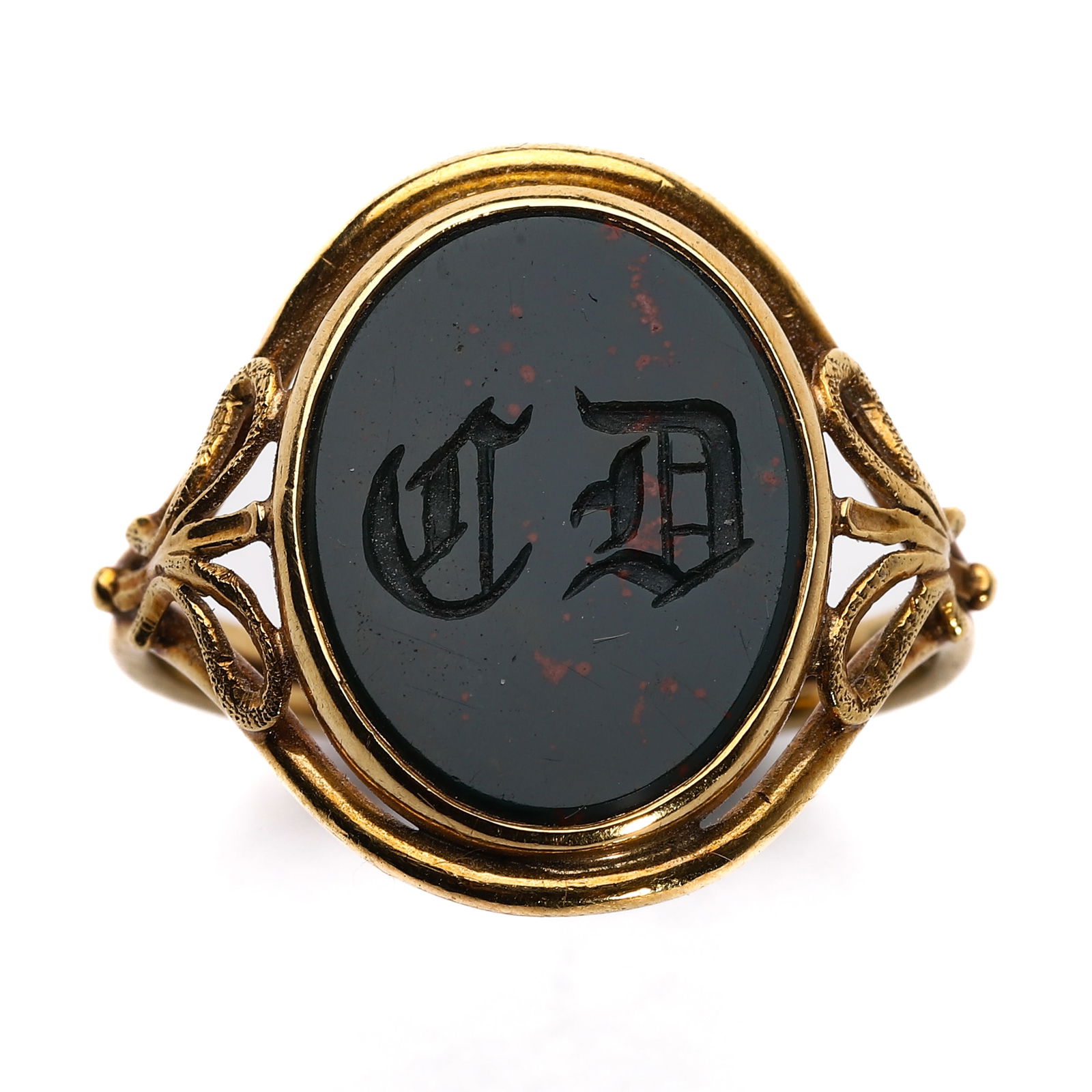 AN ANTIQUE GOLD AND BLOODSTONE INTAGLIO SIGNET RING: Dimensions Ring size: 3/4 in (19.4 mm)Bezel: 5/8 × 1/2 in (15.9 × 12.7 mm)Weight: approx. 1/8 oz (3.1 g). The oval bloodstone intaglio finely engraved with Gothic initials "C D," mounted in an openw