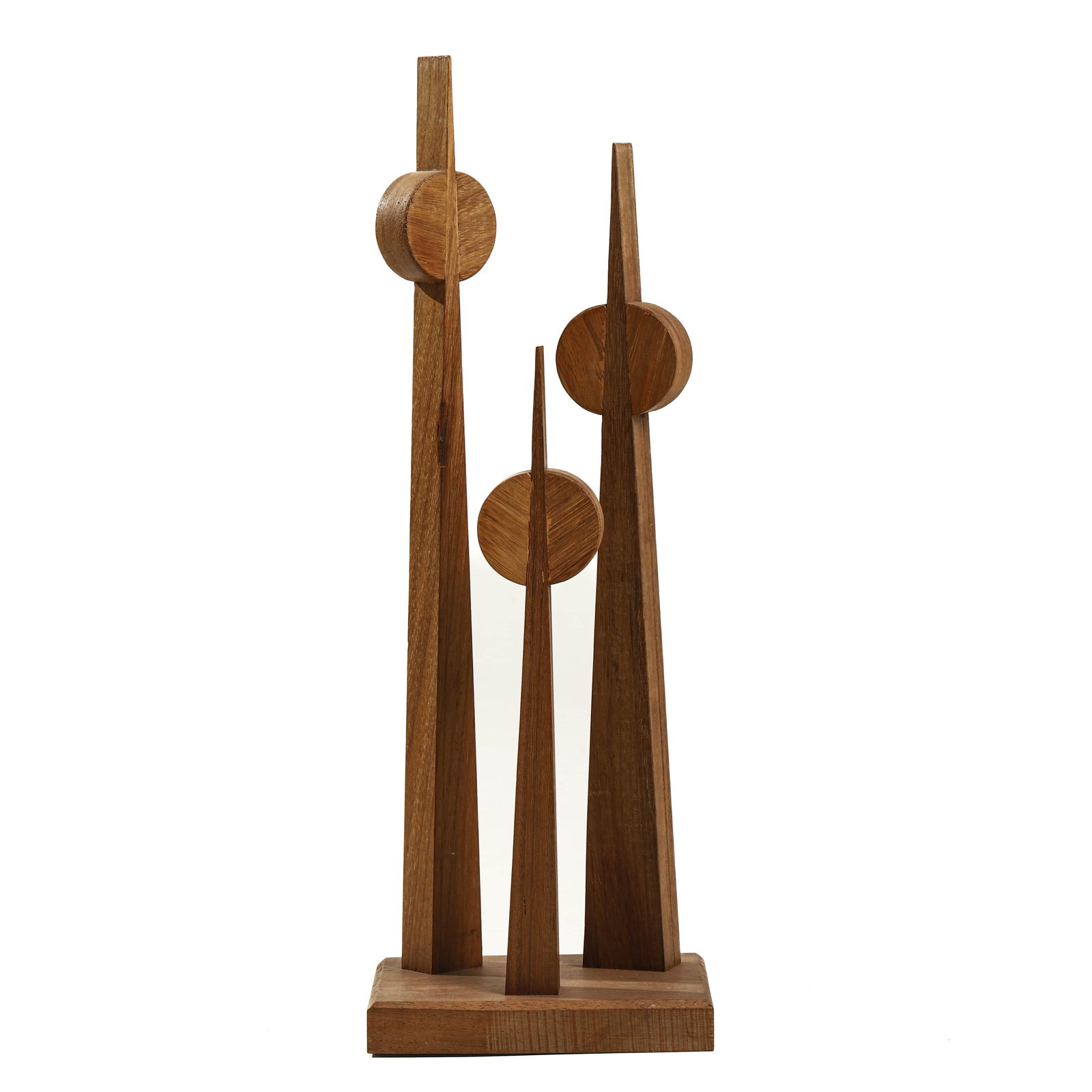 MODERNIST WOOD SCULPTURE, GEOMETRIC FORM, 20TH CENTURY: Dimensions Height: 28 3/4 in (73 cm) Description A modernist geometric wood sculpture composed of four tall, tapering vertical elements, each intersected by a circular disc form. The piece stands on
