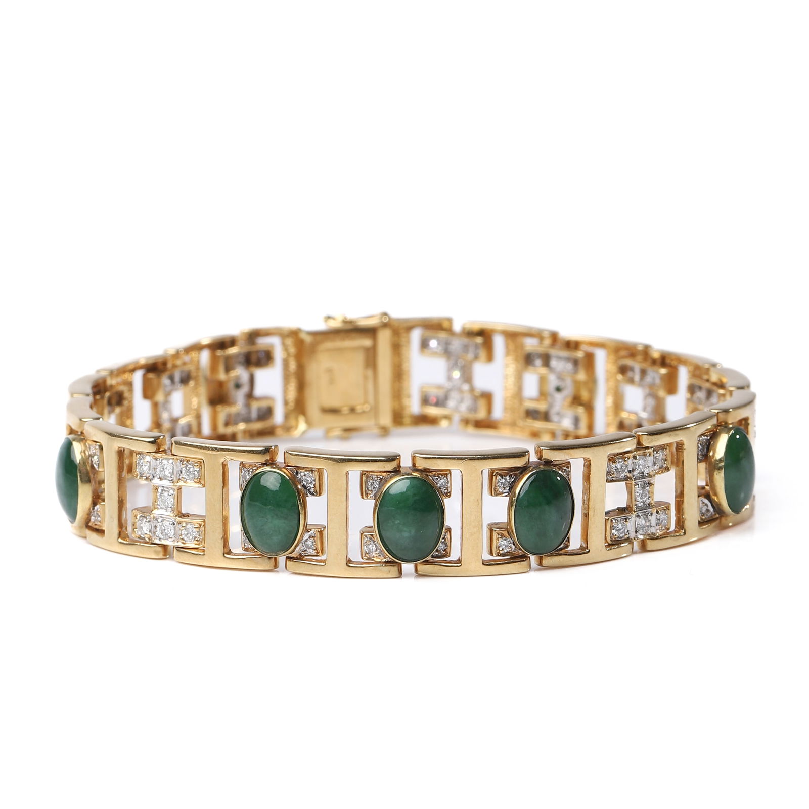 GOLD BRACELET WITH JADE CABOCHONS AND DIAMONDS: Dimensions Length: 20.7 cm; Weight: 46.3 g Description A striking 18k gold bracelet composed of articulated geometric links, each designed in an openwork fretwork pattern and accented with brilliant-c