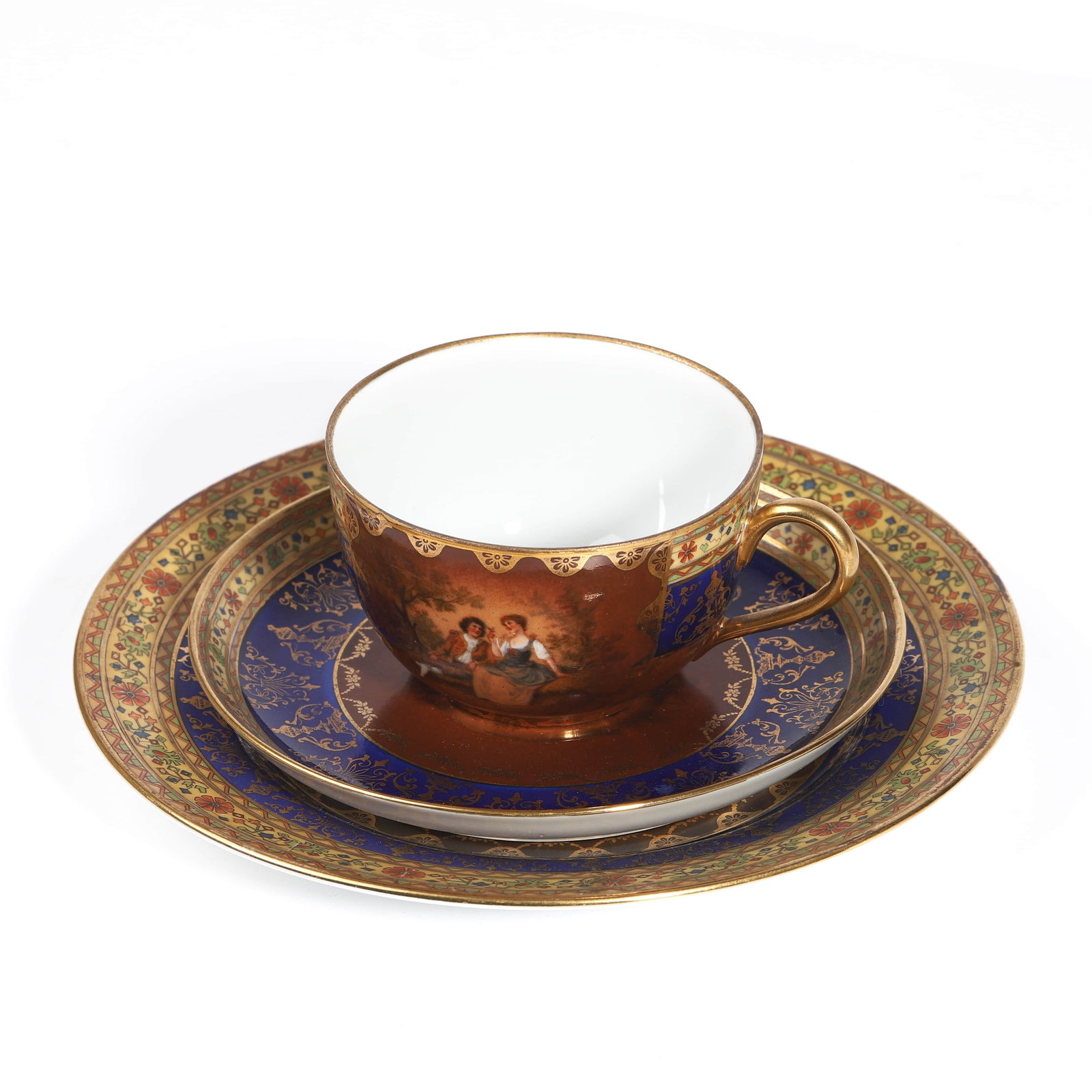 A CONTINENTAL PORCELAIN CUP AND SAUCER SET: Dimensions Cup — Diameter: 3 3/8 in (8.5 cm); Height: 2 3/16 in (5.5 cm) Small saucer — Diameter: 5 5/8 in (14.2 cm) Large plate — Diameter: 7 1/2 in (19 cm) Description: A finely decorated Cont