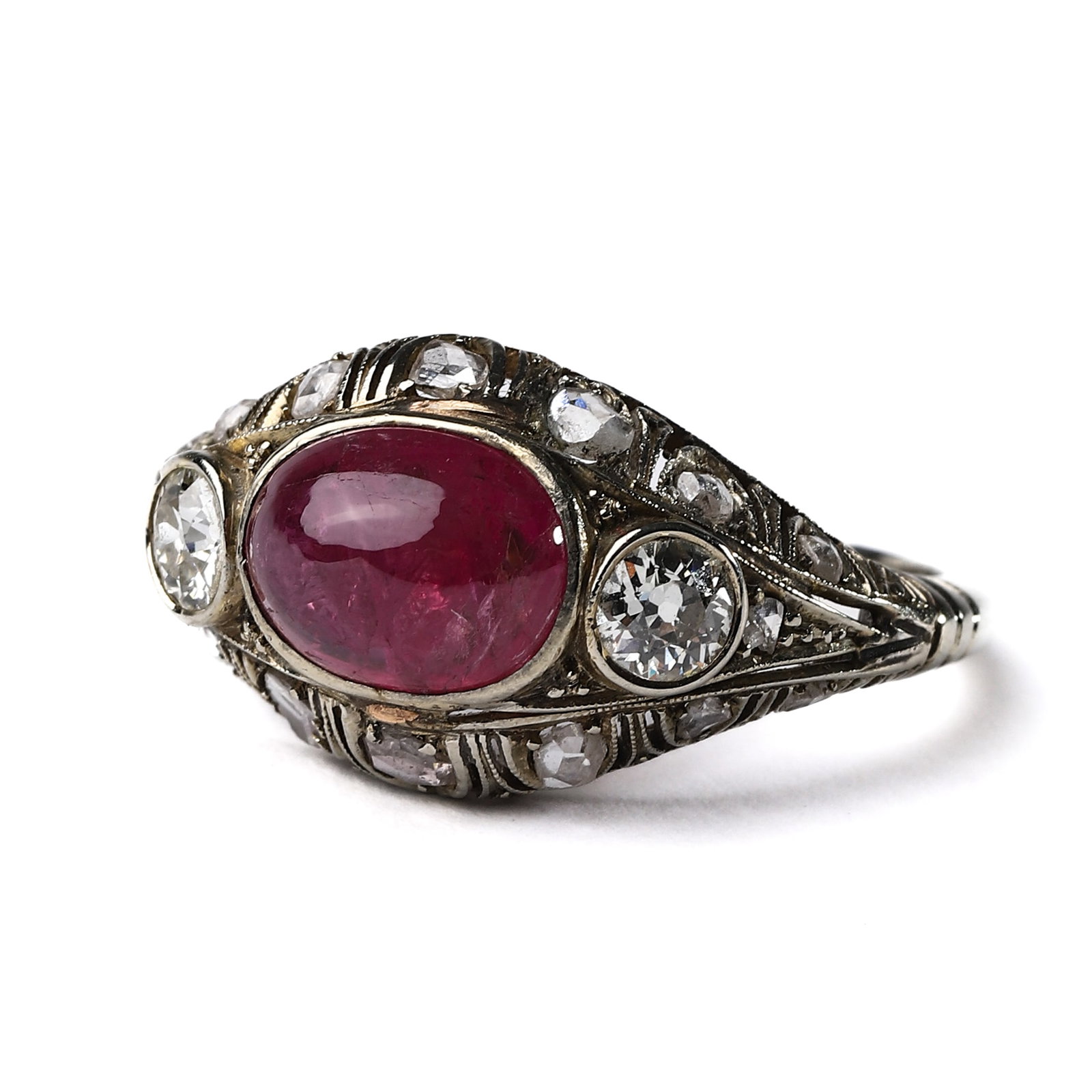Vintage Burma ruby and diamond ring: Dimensions Ring size approx. 19 mm; face 7.8 × 9.8 mm; weight 2 g. Description The ring is centered with an oval cabochon-cut Burmese ruby of deep purplish-red hue, flanked by two old European-cut di