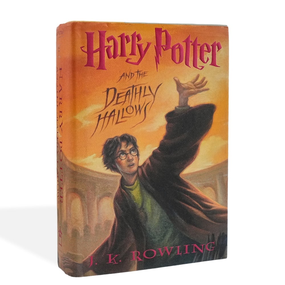 J. K. ROWLING SIGNED "HARRY POTTER AND THE DEATHLY HALLOWS" FIRST EDITION FIRST PRINTING: 9 1/4 x 6 1/4 in (23.5 x 16 cm) Few literary phenomena in modern publishing history rival the global impact and cultural influence of the Harry Potter series. Through the creation of an expansive