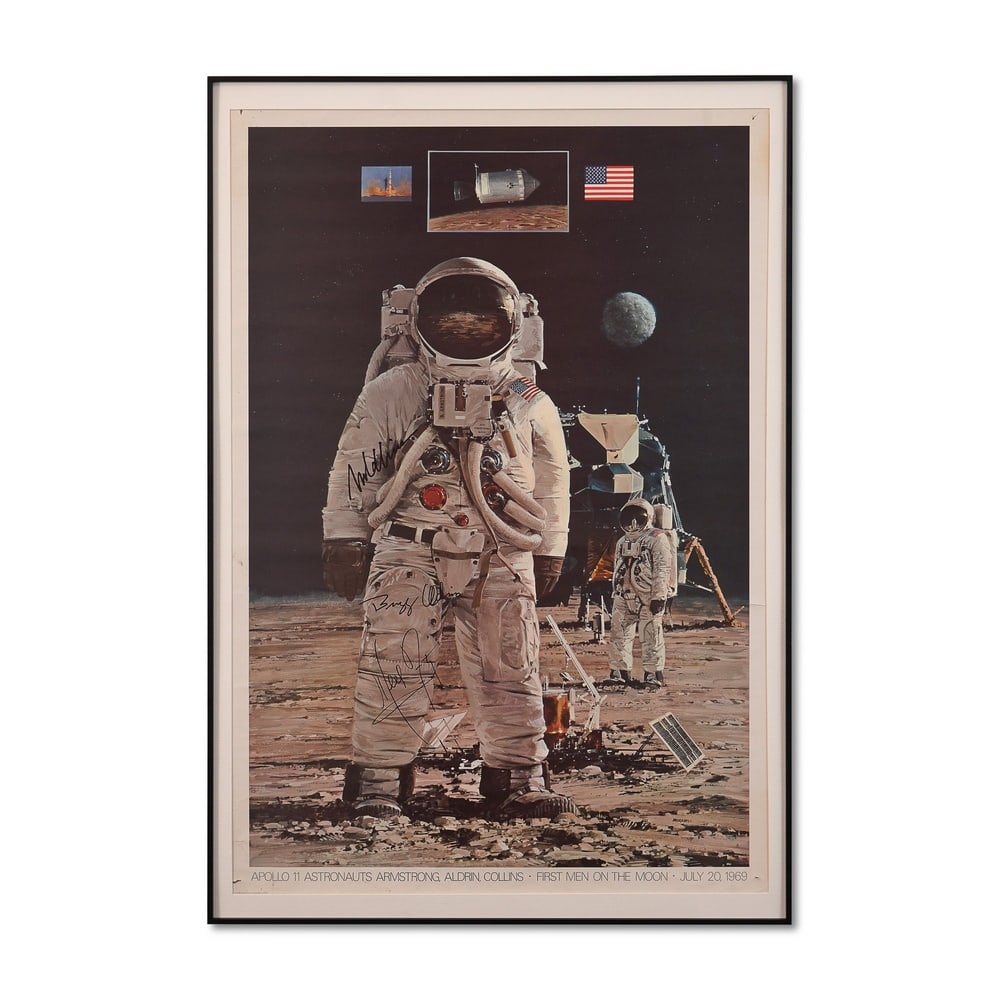 NEIL ARMSTRONG, BUZZ ALDRIN, MICHAEL COLLINS SIGNED "APOLLO 11 FIRST MEN ON THE MOON" POSTER, 1969: 40 1/8 x 27 3/8 in (101.9 x 69.5 cm, including frame) Provenance and Authentication: This collectible has undergone a rigorous forensic evaluation. The signatures were carefully analyzed across