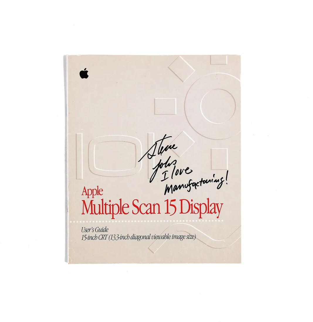 STEVE JOBS (1955-2011) - INSCRIBED "I LOVE MANUFACTURING!" AND SIGNED APPLE USER'S GUIDE (1 of 3)