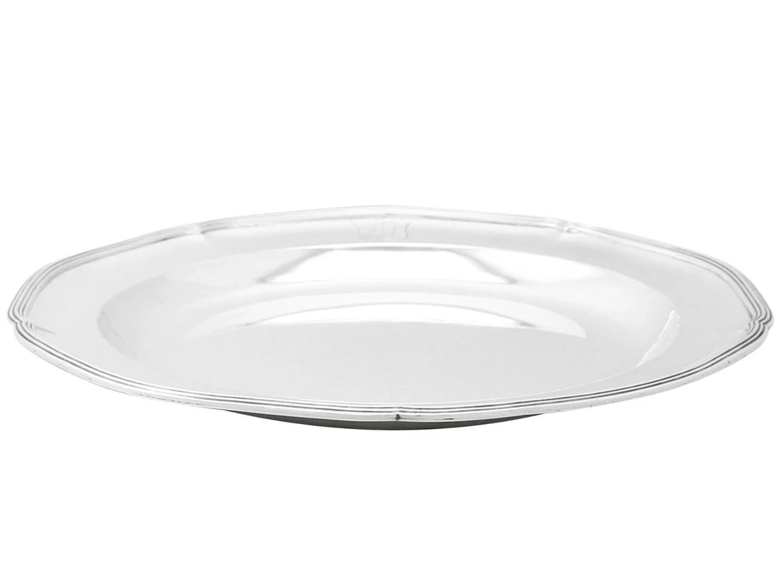 SET OF SILVER-STYLE DINNER PLATES WITH BEADED BORDERS: SET OF SILVER-STYLE DINNER PLATES WITH BEADED BORDERS Description: A group of circular silver-tone plates with broad plain wells and subtly raised rims finished with a beaded or molded border treatmen