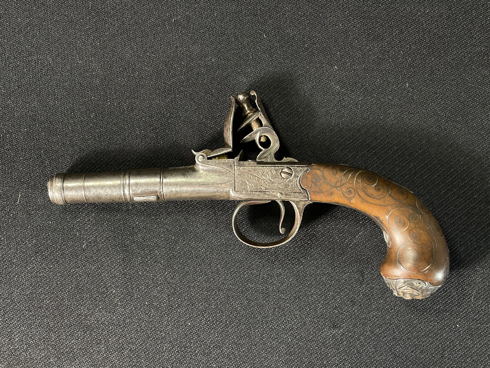 T. Adams Single Shot Pistol: Pre 1830's With Both Flint and Box Lock, Wire inlay in Handle , and Grotesque Mask on Bottom Grip, (Missing Barrel Key)