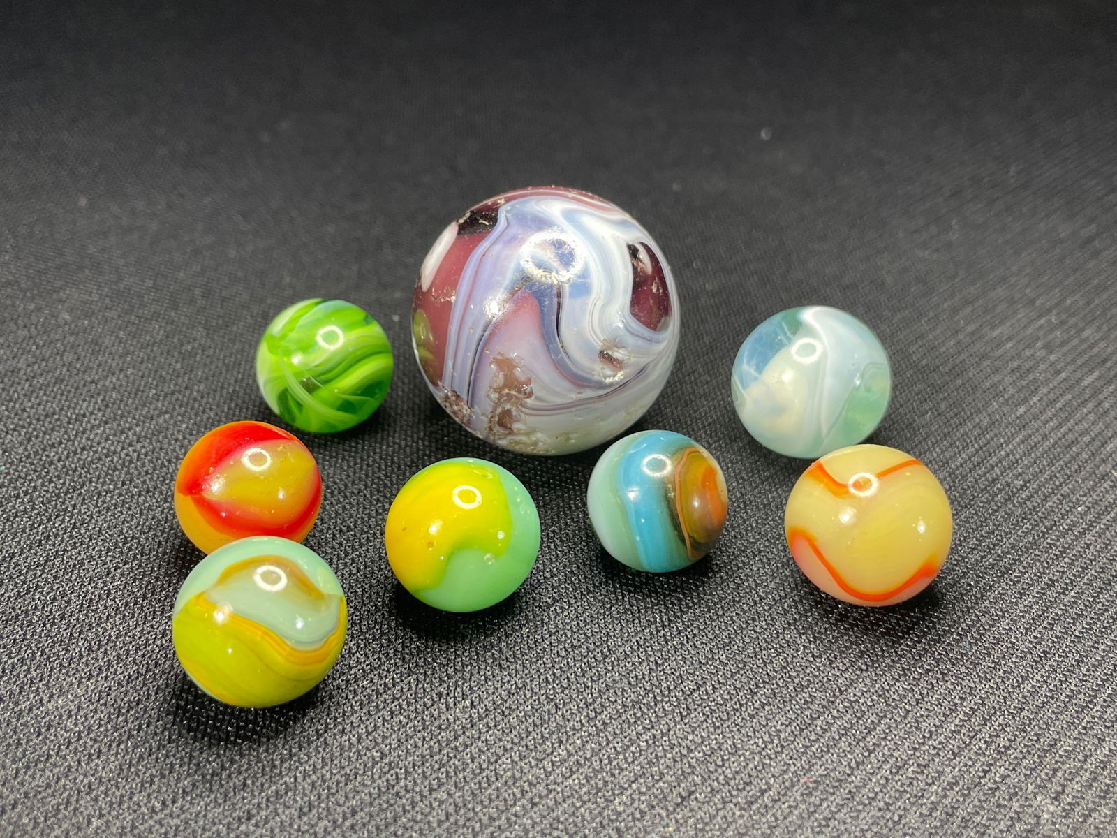 (8) Assorted Marbles , Largest M.F. Christianson Measuring 1-1/4" w/ Extensive Hits,: Also Peltier Examples