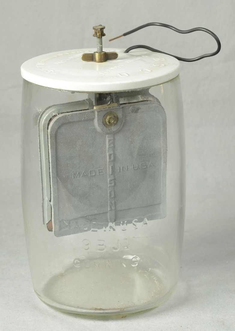 EDISON BATTERY JAR, W/ CERAMIC LID & LEAD PADDLES.: EDISON BATTERY JAR, W/ CERAMIC LID & LEAD PADDLES. 10" H. LID MARKED "B S C O" & ALSO MARKED "PRIMARY BATTERY NO. THOMAS A. EDISON TRADE MARK MAN'F'D. BY EDISON MFG. CO. ORANGE. N.J. U.S.A."