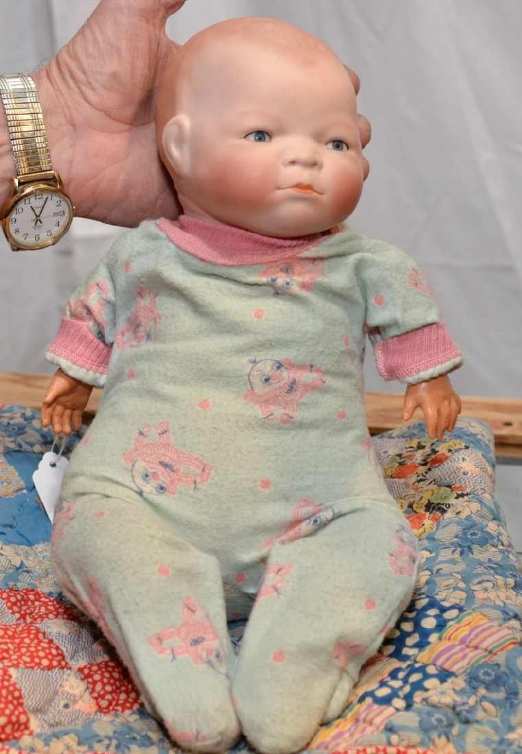 GRACE S. PUTMAN 14" DOLL, c.1922, BISQUE HEAD W/ S: GRACE S. PUTMAN 14" DOLL, c.1922, BISQUE HEAD W/ SLEEPY EYES, SOME PAINT LOSS TO EYELIDS. CLOTH BODY, COMPOSITION HANDS & FEET, IMPRESSED ON BACK OF NECK "COPR. BY GRACE S. PUTMAN, MADE IN GERMANY", W