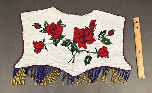 Beaded front cape: 17" x 10" Low Estimate: 50.00High Estimate: 100.00