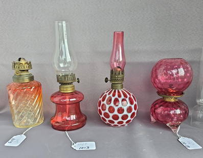 4 minature cranberry lamps: &nbsp;all early 1890's-1900's lamps, 1 baccarat, 1 coin dot, 1 Gone with The Wind and 1 table lamp all under 10"  Low Estimate: 100.00 High Estimate: 200.00