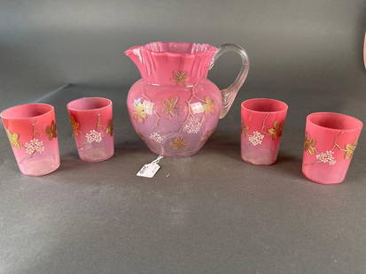 Pink Victorian pitcher, 4 glass lemonade set: Pitcher is 7 1/2" tall, enameled art glass Low Estimate: 50.00 High Estimate: 250.00