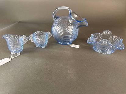 4 pcs blue caprice depression glass: demi sugar and creamer, candy dish and lemonade pitcher Low Estimate: 20.00 High Estimate: 60.00