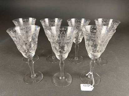 Set of 7 floral etched crystal stems: 7-3/4" tall Low Estimate: 20.00 High Estimate: 40.00