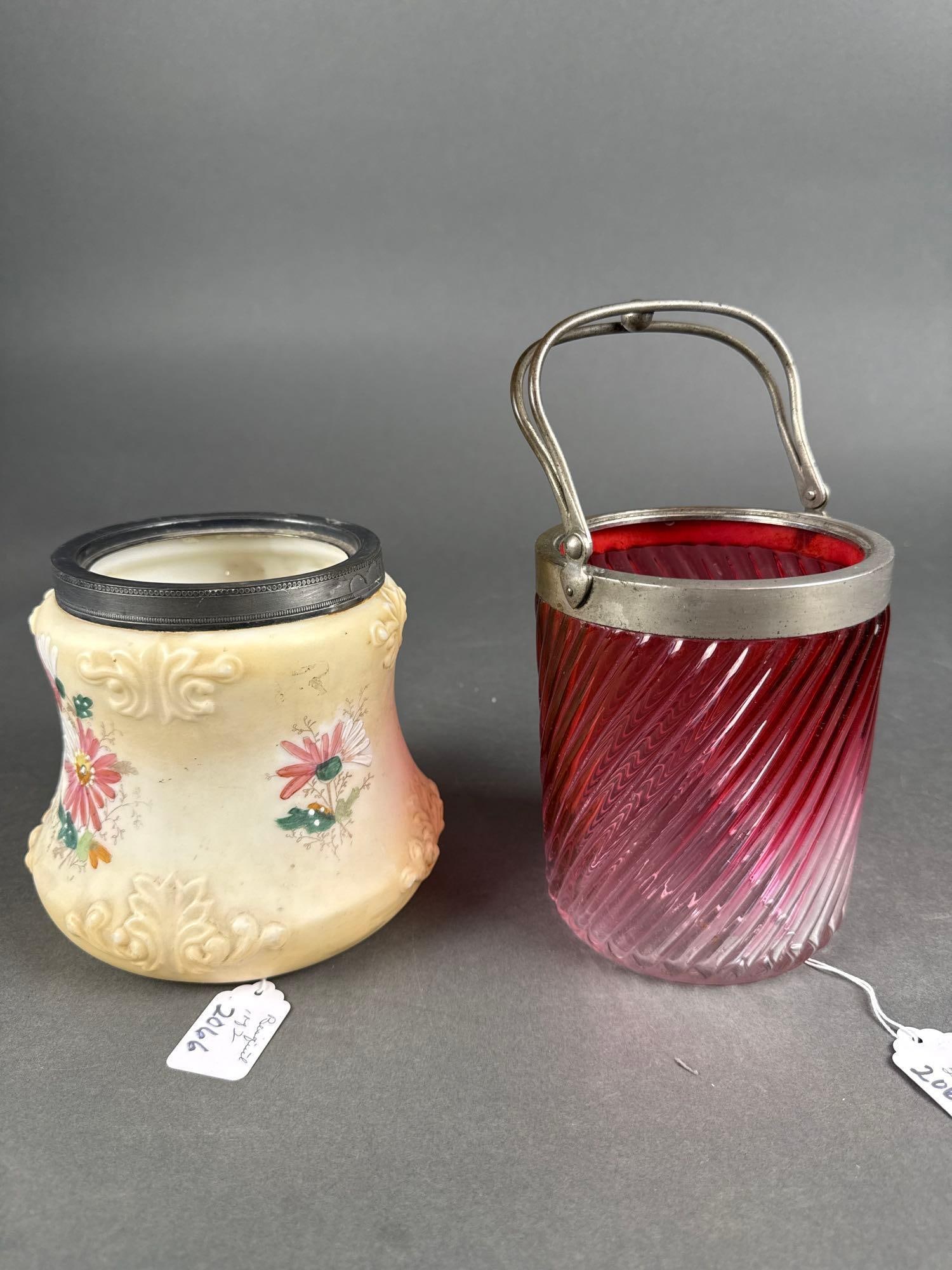 2 bisquit jars no lids: 1 floral decor. 1 rubena ruby to clear Low Estimate: 10.00 High Estimate: 30.00