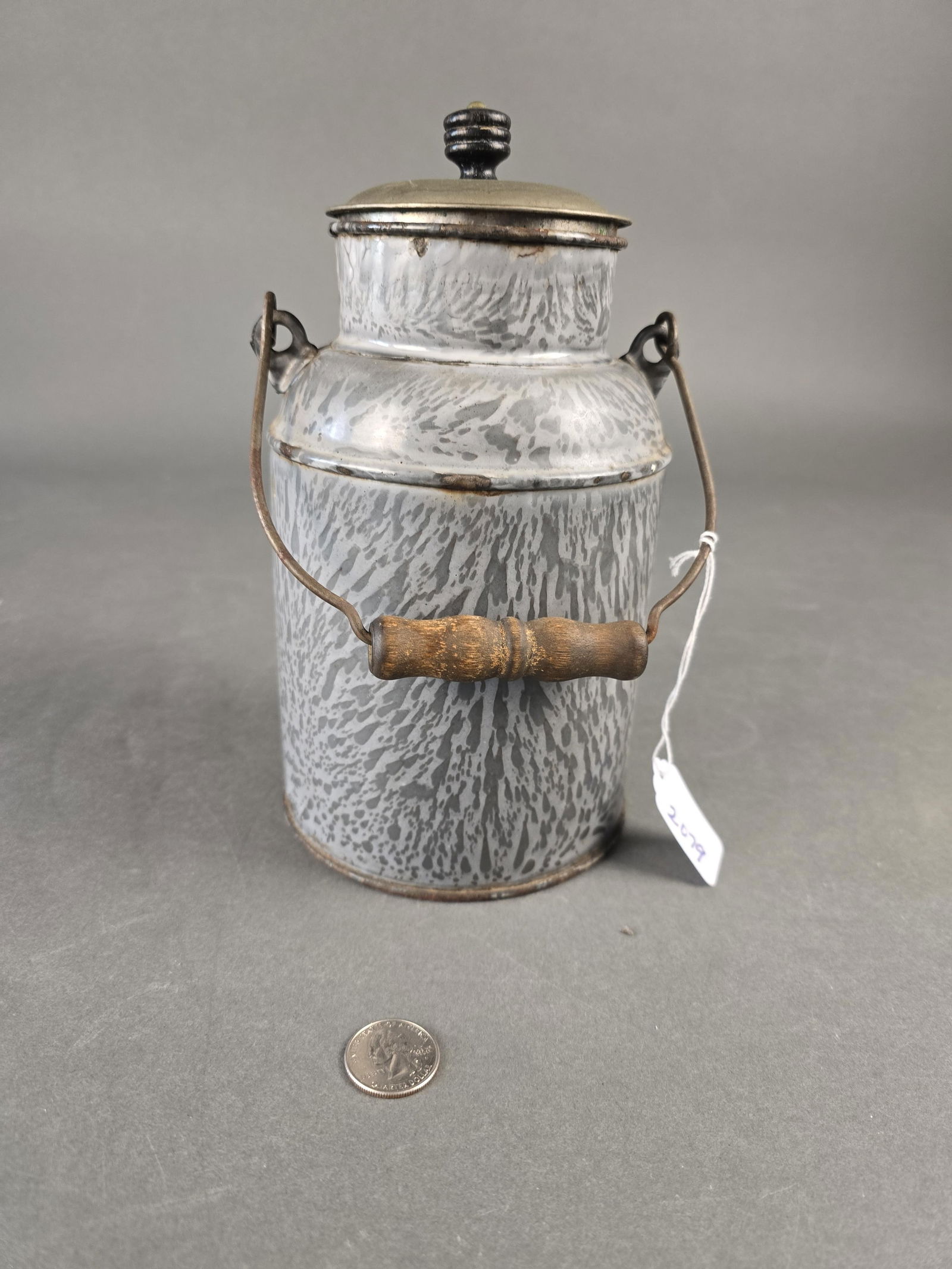 Grey granite milk jug: 10" wooden handle and knob Low Estimate: 30.00 High Estimate: 60.00