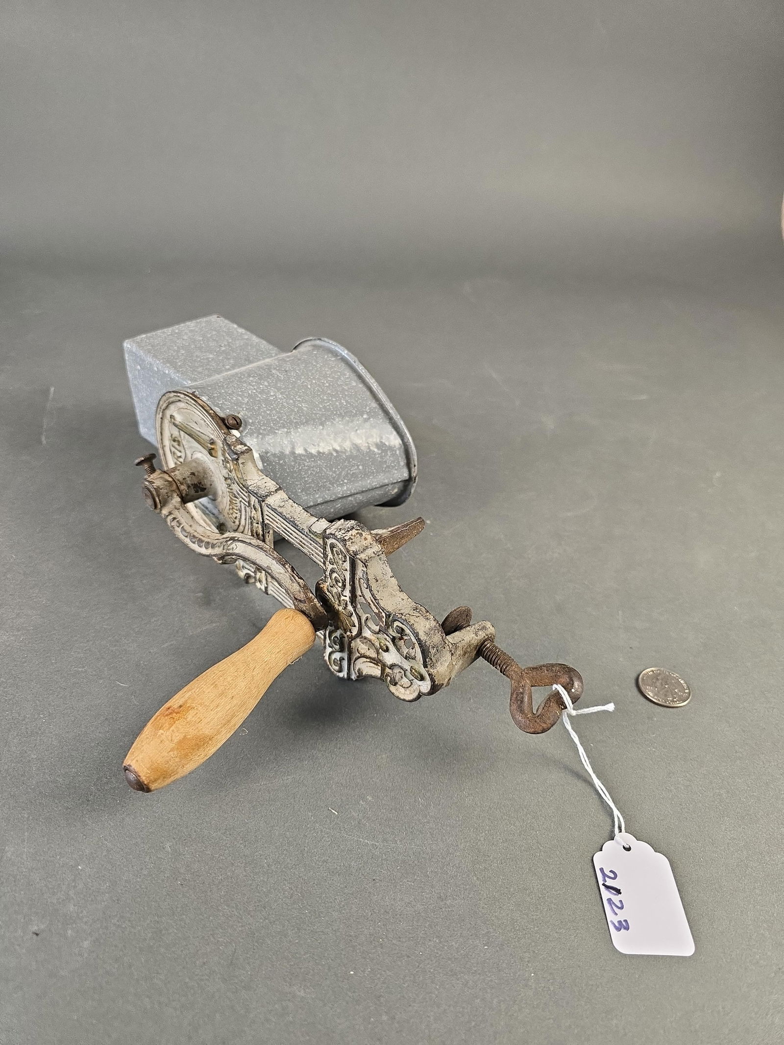 Grey granite food grinder: 12" wooden handle Low Estimate: 20.00 High Estimate: 40.00