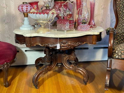 1870's Marble turtle top walnut coffee table: 34"long 26" high 24" wide Low Estimate: 200.00 High Estimate: 400.00