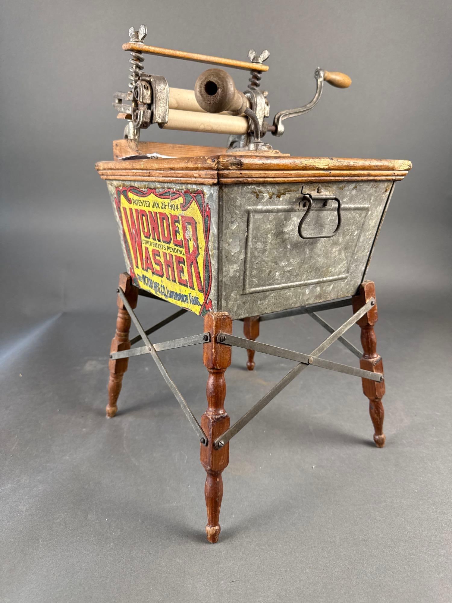 1904 Wonder washing machine complete with Victor wringer:  20" x 11" Low Estimate: 150.00 High Estimate: 350.00