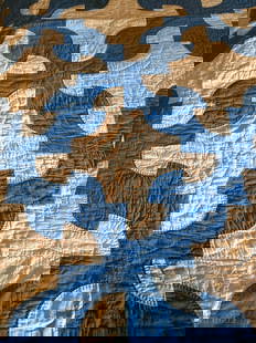 Blue and white quilt made by Mrs Cooper: The quilt was made by John Richardson, Stites,ID. grandmother for his mother. After the 1948 flood the quilt was found in some bushes along the river&nbsp;  Low Estimate: 30.00 High Estimate: 100.00
