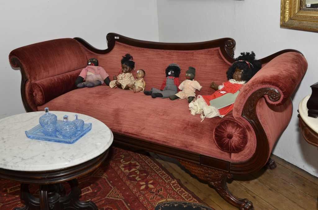 EMPIRE STYLE MAHOGANY SETTEE WITH SCROLL ARMS & CUSHION: EMPIRE STYLE MAHOGANY SETTEE WITH SCROLL ARMS & CUSHION ROLLS. FEATHERED LEGS W/ PAW FEET. 89" W. X 33" H. @ THE ARMS X 27" D.