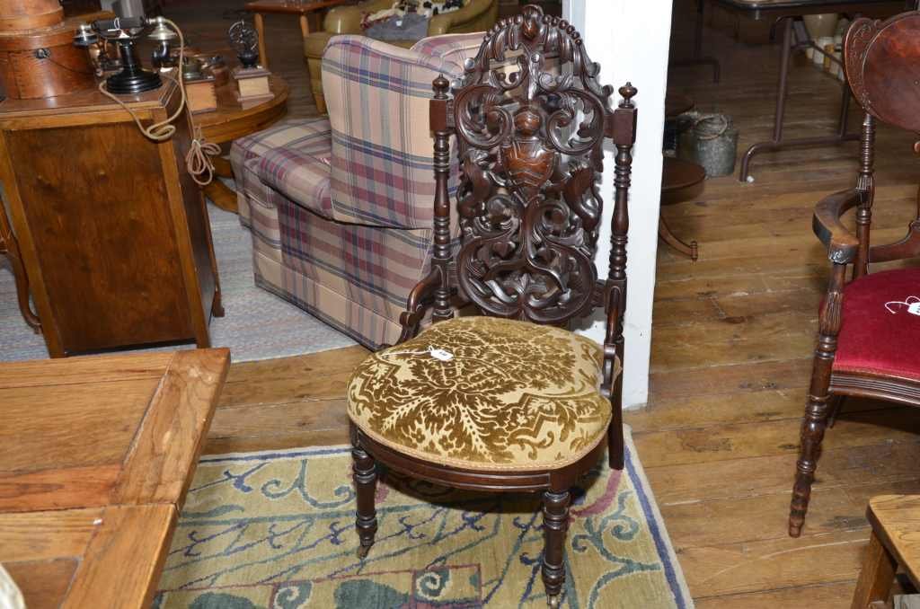RENAISSANCE REVIVAL PARLOR CHAIR IN THE BELTER STYLE. B: RENAISSANCE REVIVAL PARLOR CHAIR IN THE BELTER STYLE. BACK W / CARVED CREST & LIONS. UPHOLSTERED SEAT. TURNED FRONT LEGS ON CASTERS. 39 1/2" H. DAMAGE NOTED: SPLIT ON LOWER BACK.