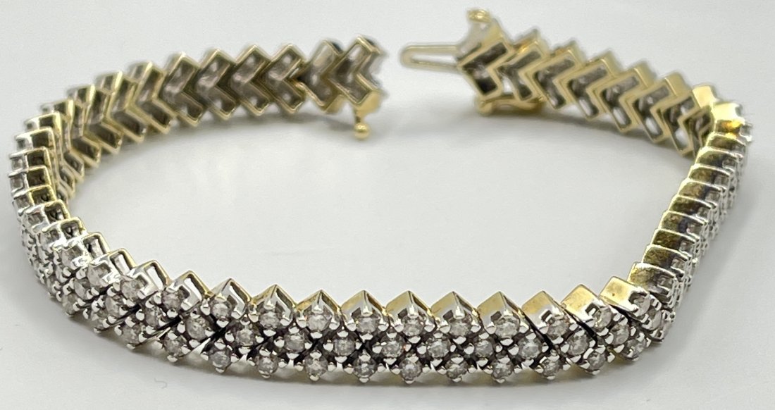 Fantastic 14k Gold and Diamond Tennis Bracelet: Over 3 carats of diamonds, triple row tennis bracelet. 7.25" long. Total weight 21.3 grams.