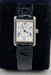 Vintage Cartier Sterling Silver Tank Watch: Cartier unisex stering silver tank watch. Sapphire crown, Cartier logo dial with secret signature. Leather Cartier band with deployant Cartier clasp. Genuine Cartier watch, working condition.