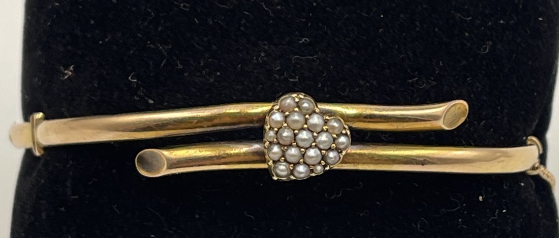 Victorian 14k Yellow Gold Pearl Heart Bangle Bracelet: 14k bypass with pave pearl heart center. Has safety chain. Inside circumference 6". Total weight 7.5 grams.