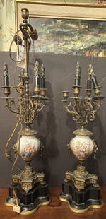 Pair of Sevres Urn Form Candelabras: Converted to lamps, porcelain is in good condition. One lamp missing center rod. Please see photos.