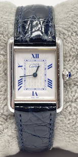 Vintage Cartier Sterling Silver Tank Watch: Cartier unisex sterling silver tank watch. Sapphire crown, Cartier logo dial with secret signature. Leather Cartier band with deployant Cartier stainless steel clasp. Genuine Cartier watch, working co