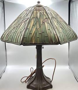 Handel Signed Cattail Panel Lamp: Circa 1915 Signed Handel Cattail slag glass overlay lamp with Signed Handel base. Has 8 caramel color panels with green cattail leaves and burgundy tips. Height 24", diameter 18.5" good condition, had