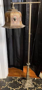 Bradley & Hubbard Adjustable Floor Lamp with Mica Shade: Adjustable lamp both ways, with 2 toned mica shade with lion heads. Overall good working condition but should be rewired. Overall height 56" tall.